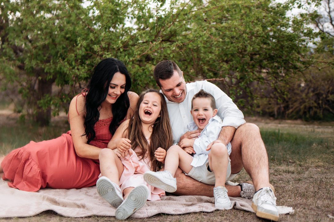 Kaylee, Derek and their children laughing together